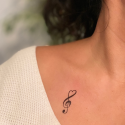 Show your passion for music with the temporary heart music note tattoo.